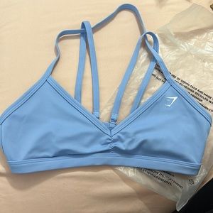 Brand new. Size medium. Gymshark minimal sports bra. Removable back straps.